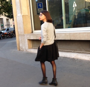This is a classic Parisian look. A simple change of shoes and jewelry and she's ready for an evening out.